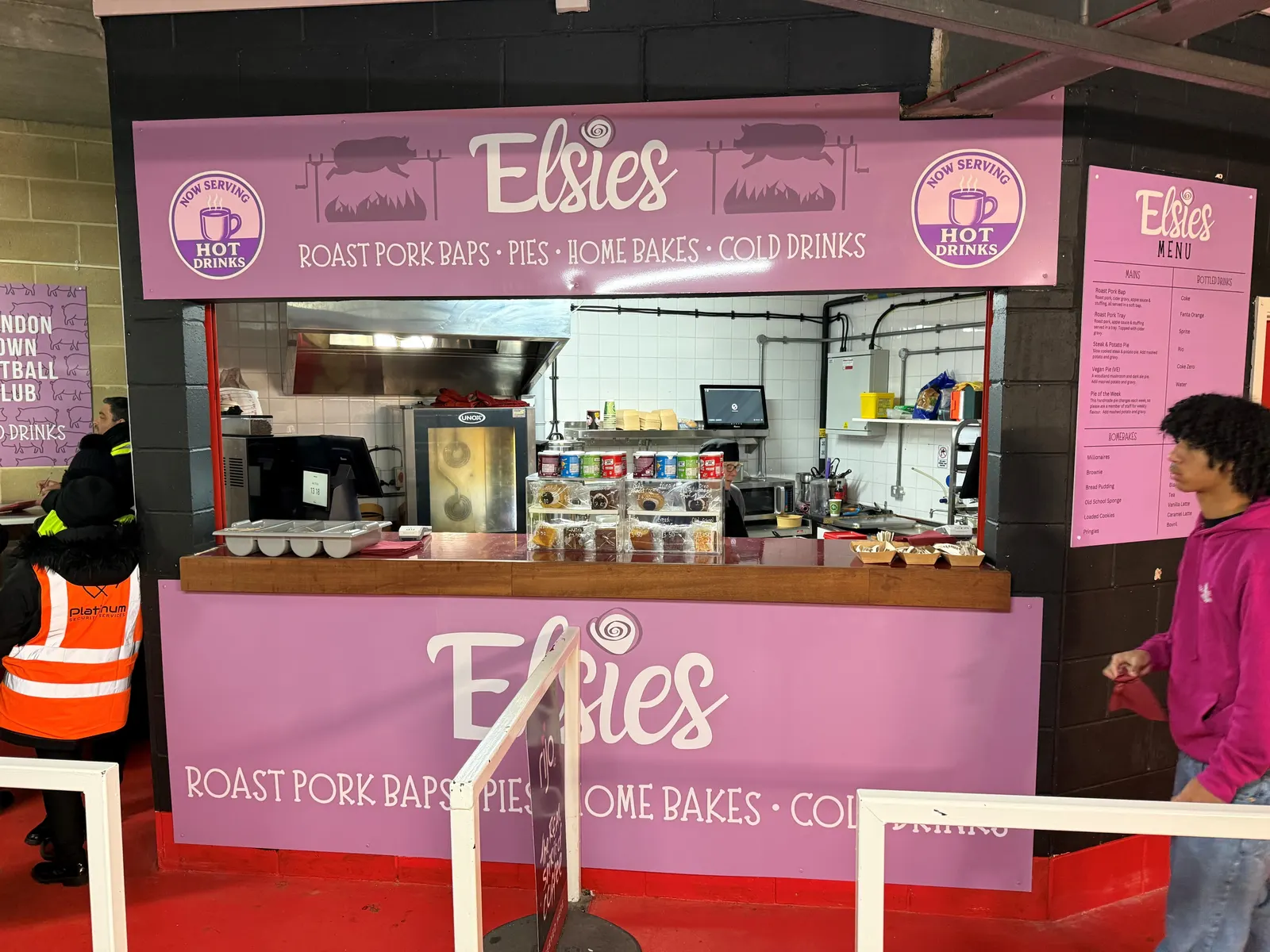 The Elsies kiosk at Swindon Town, painted pink and mauve, serving roast pork baps, pies and home bakes